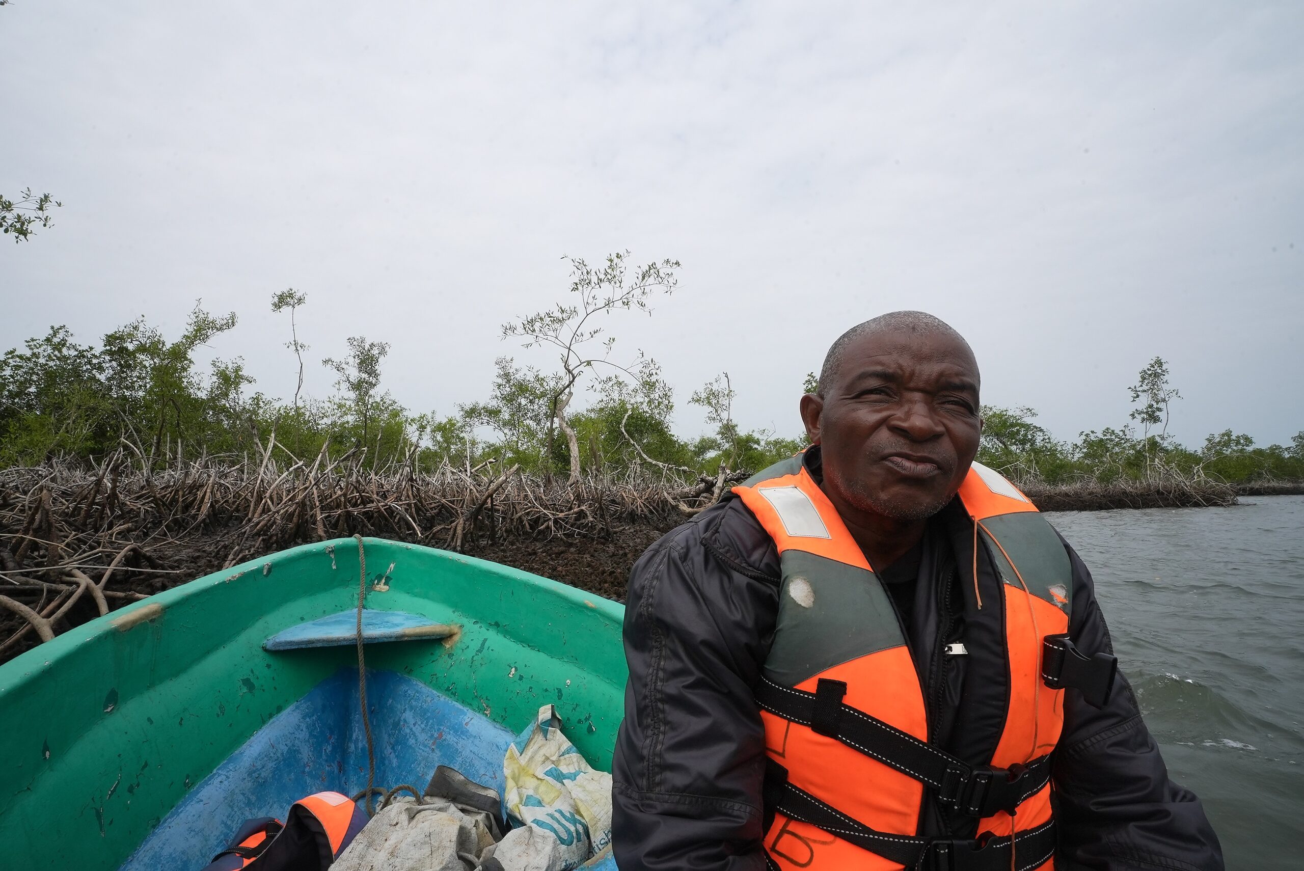 Sierra Leone Children rough and tumble on fishing nets near