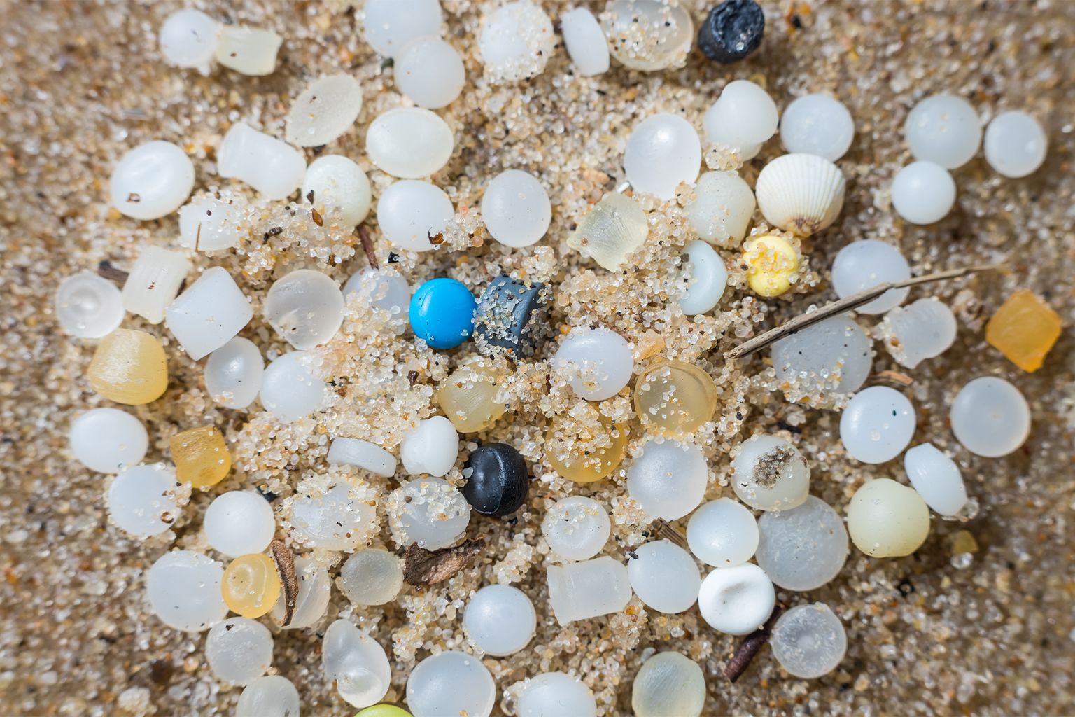 Plastic pellets on a beach.