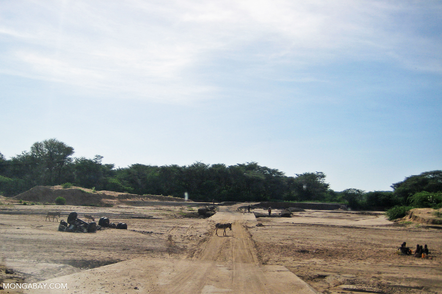 A road across a dry riverbed.