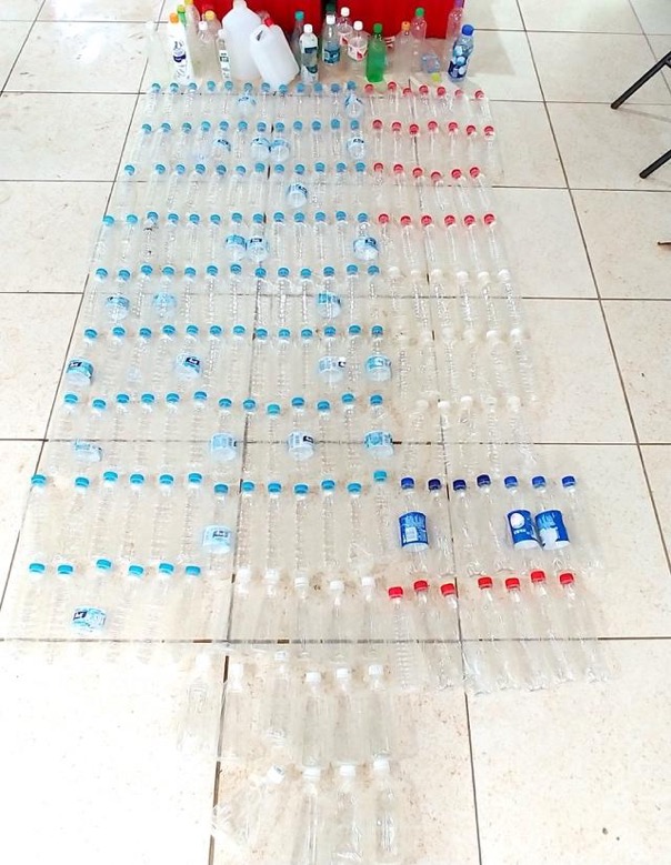 Segregation of plastic water bottle types. All of these bottles have Asian origins.