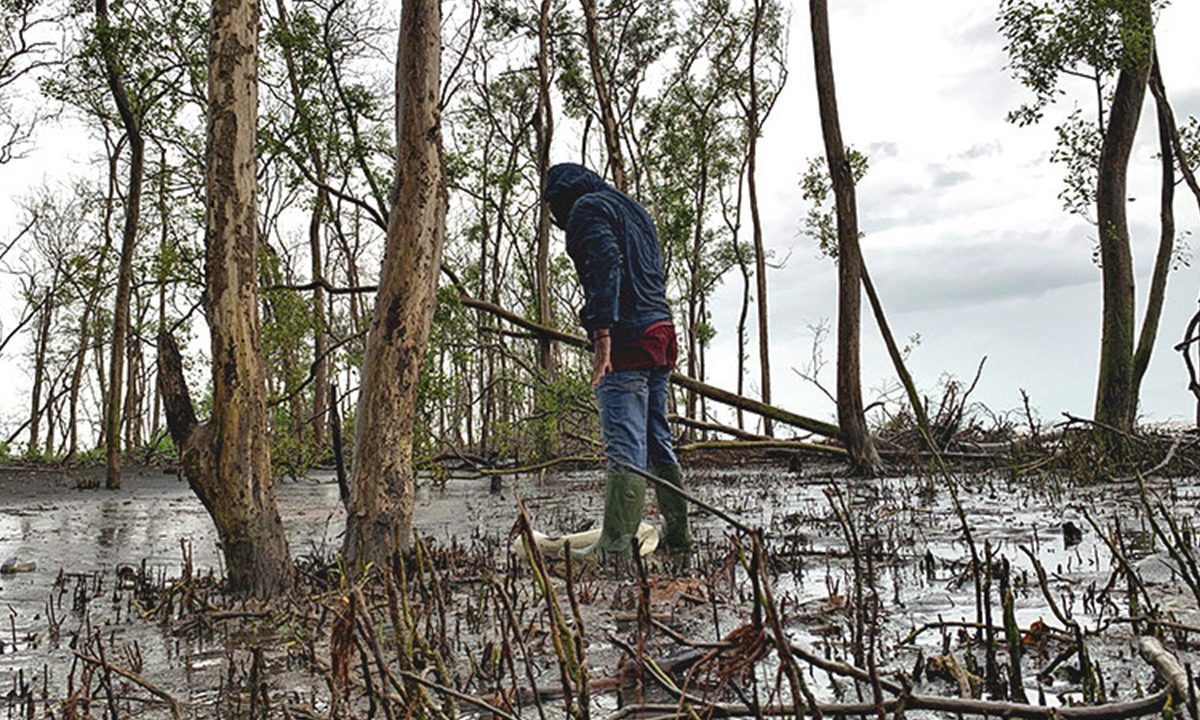 A fisherman looks for crabs.