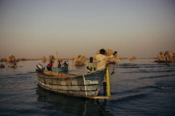Fishermen at dawn heading out onto Lake Turkana to try their luck for the day. Image by Kang-Chun Cheng.