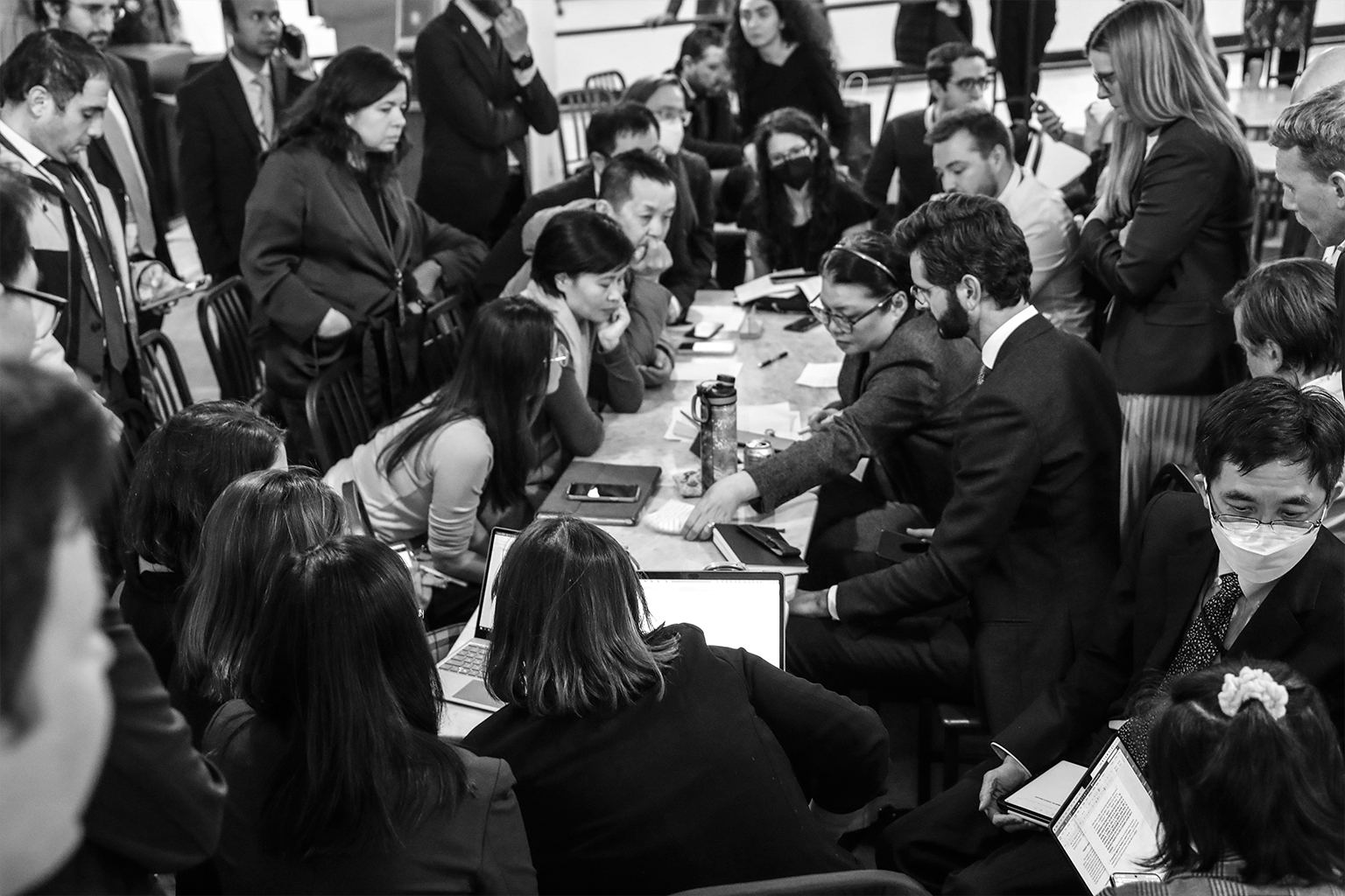 Delegates work into the early morning hours to agree on a provision on disputed areas.