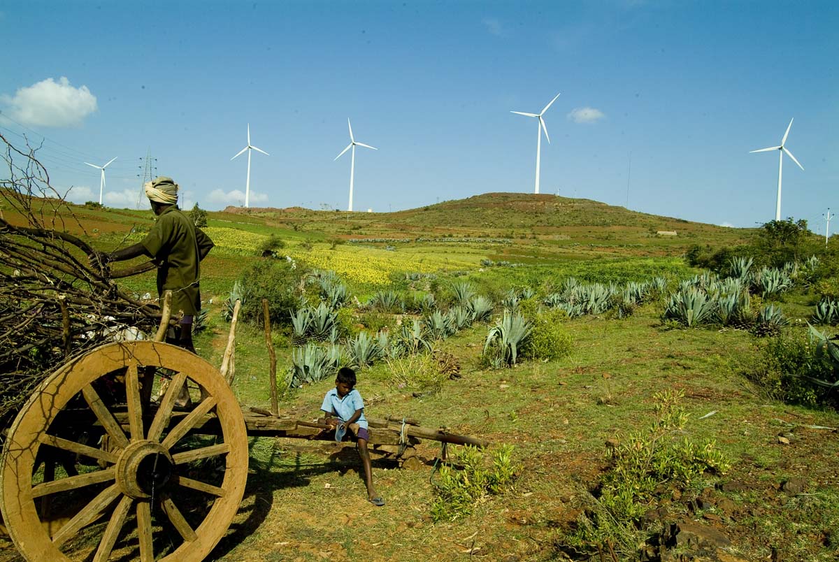 Wind turbines set up in India by Yahoo as a carbon offsetting project. Several reports have found that carbon credits often overestimate carbon reductions, count reductions that would have happened even without the project and can harm the Indigenous peoples and local communities whose lands are often at play in the carbon projects — several Indigenous groups and researchers have even called for a moratorium on the carbon trade. Image by Vestas/Yahoo via Flickr (CC BY 2.0).