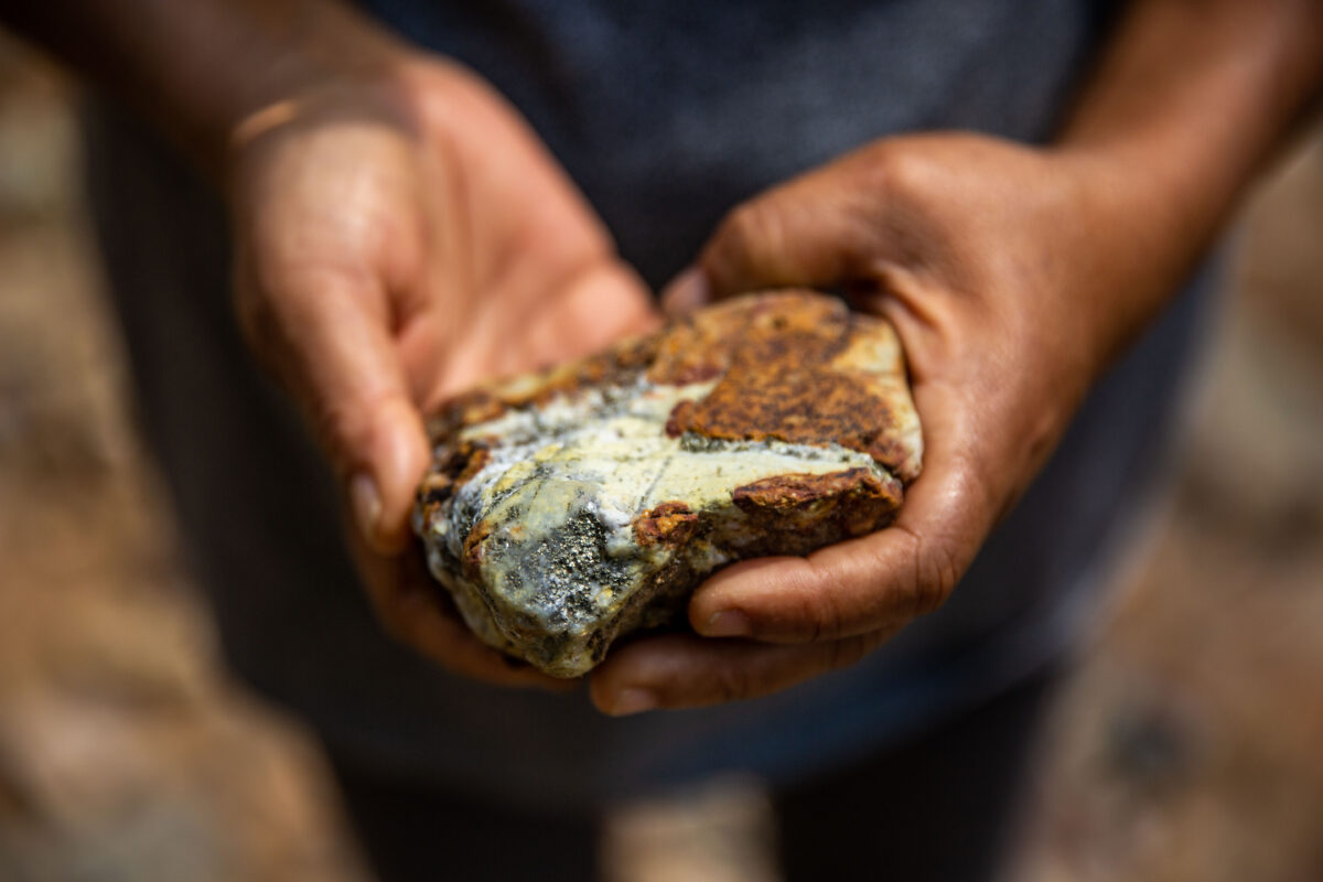 Ofelia Samboni an Indigenous Yanacona member and landowner in Monclart, holds a stone containing copper. The stone was found in the river close to the mining area. Image by Antonio Cascio for Mongabay.