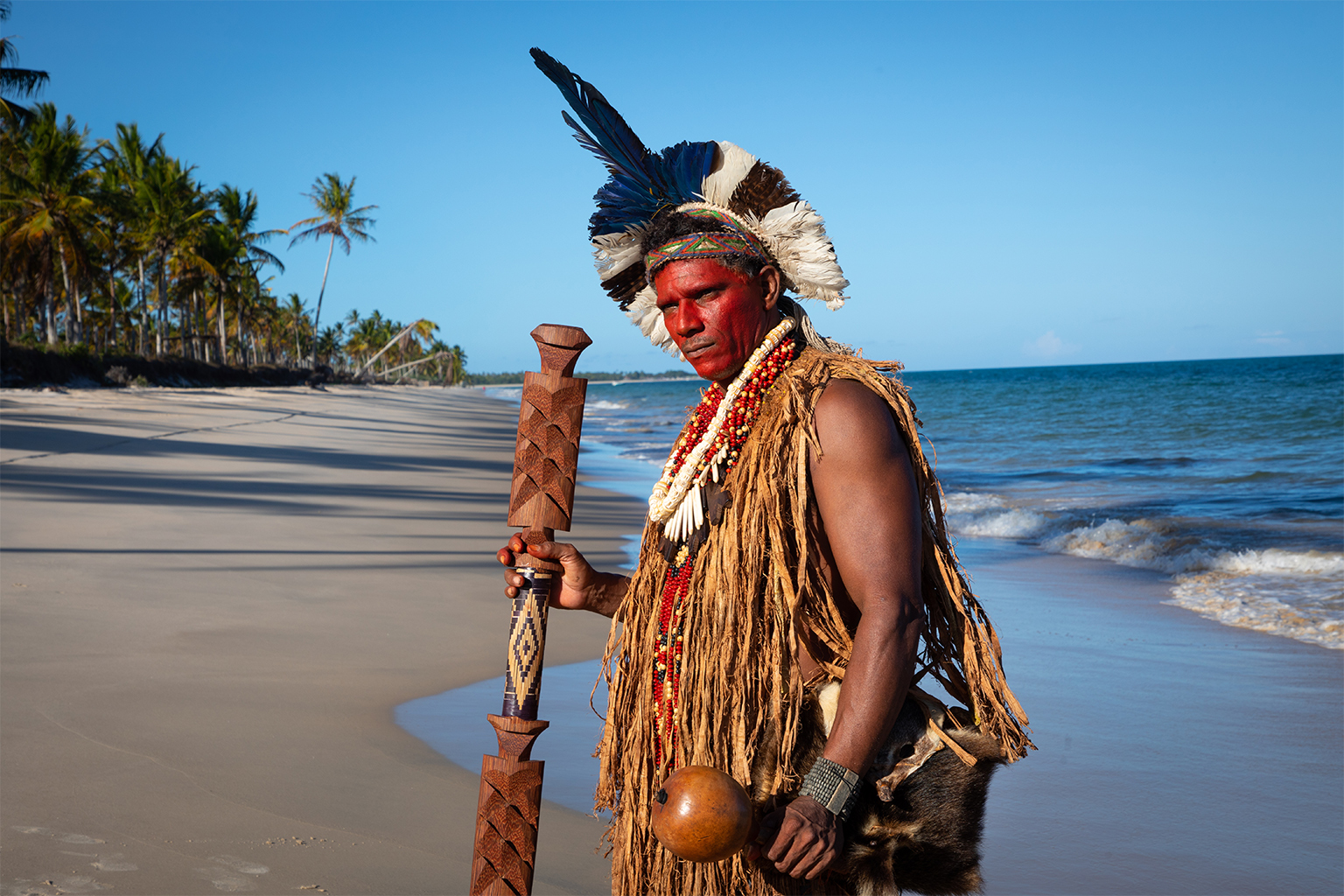 Chief Patiburi Pataxó stands on the beach of the reclaimed Quero-Ver community.