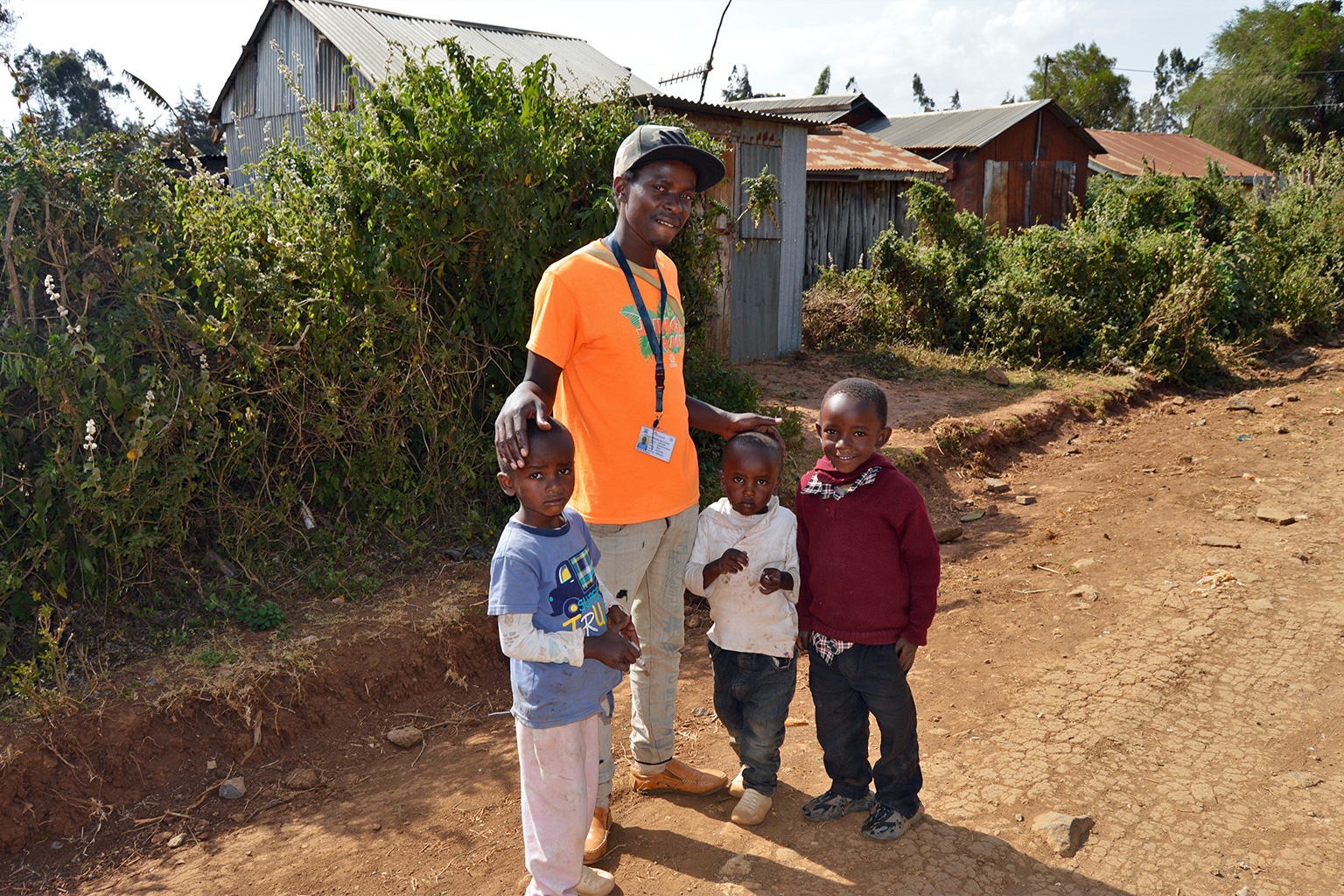 George Karanja with his children and a neighbor's child. 