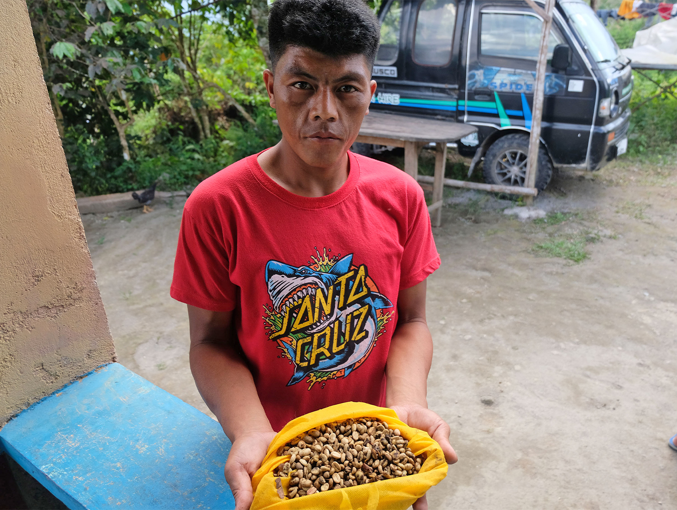 A villager shows a bag of civet coffee beans he gathered in just one day.