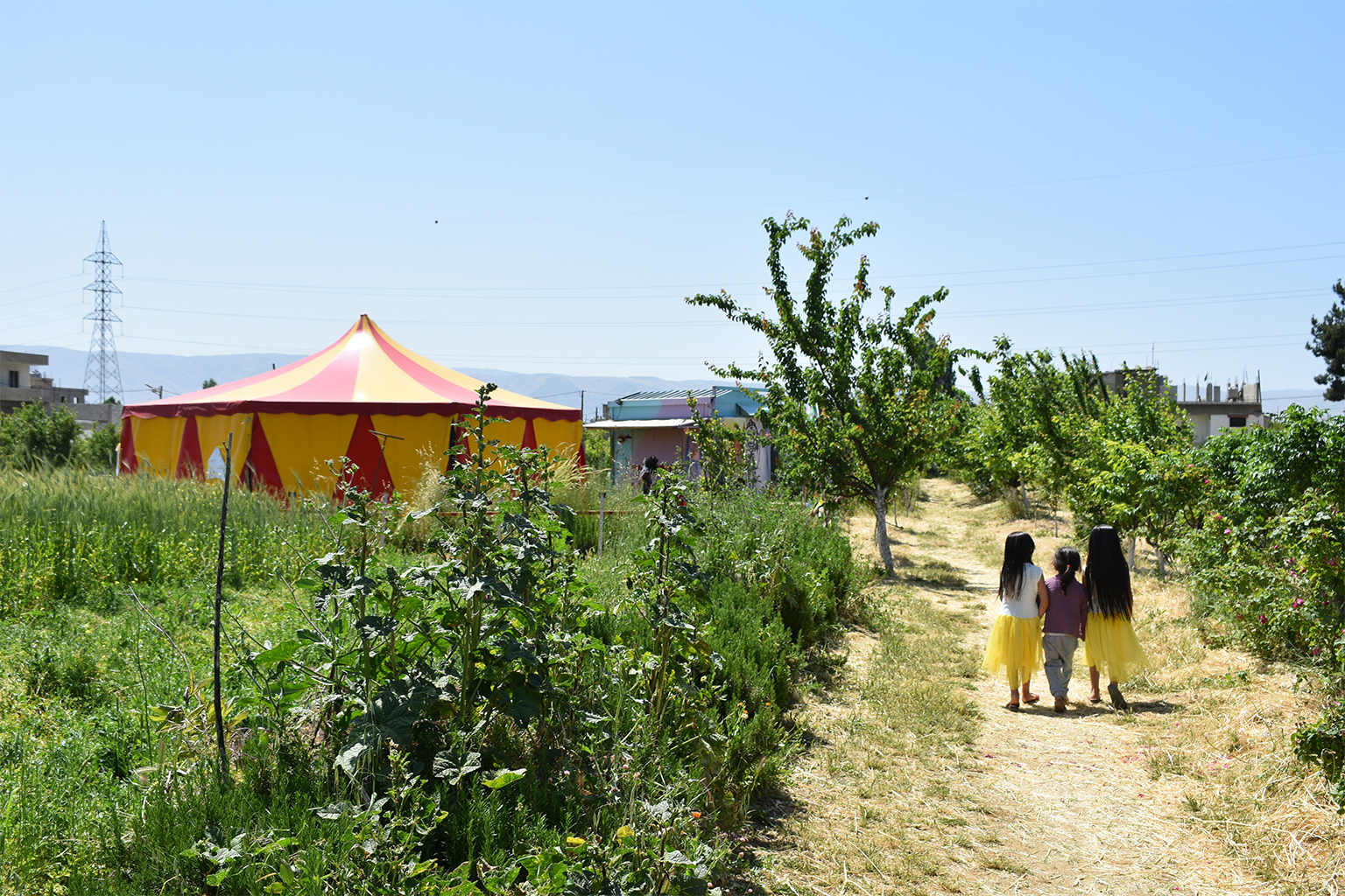 Three girls on their way to the Bulaban circus tent.