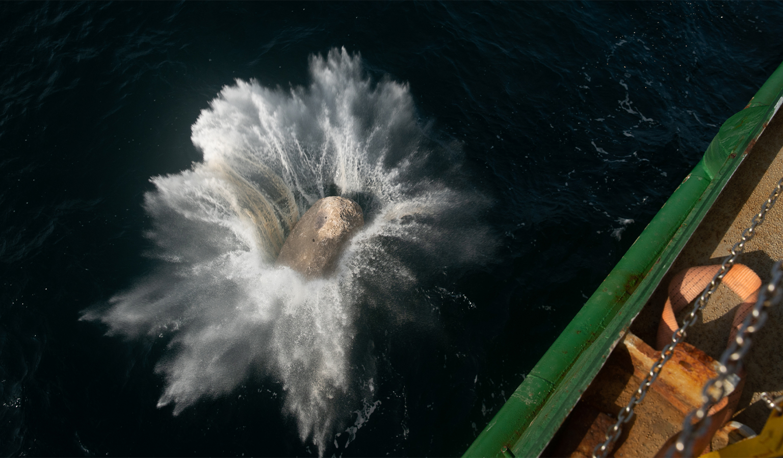 Greenpeace campaigners drop a granite boulder into the Dogger Bank marine protected area