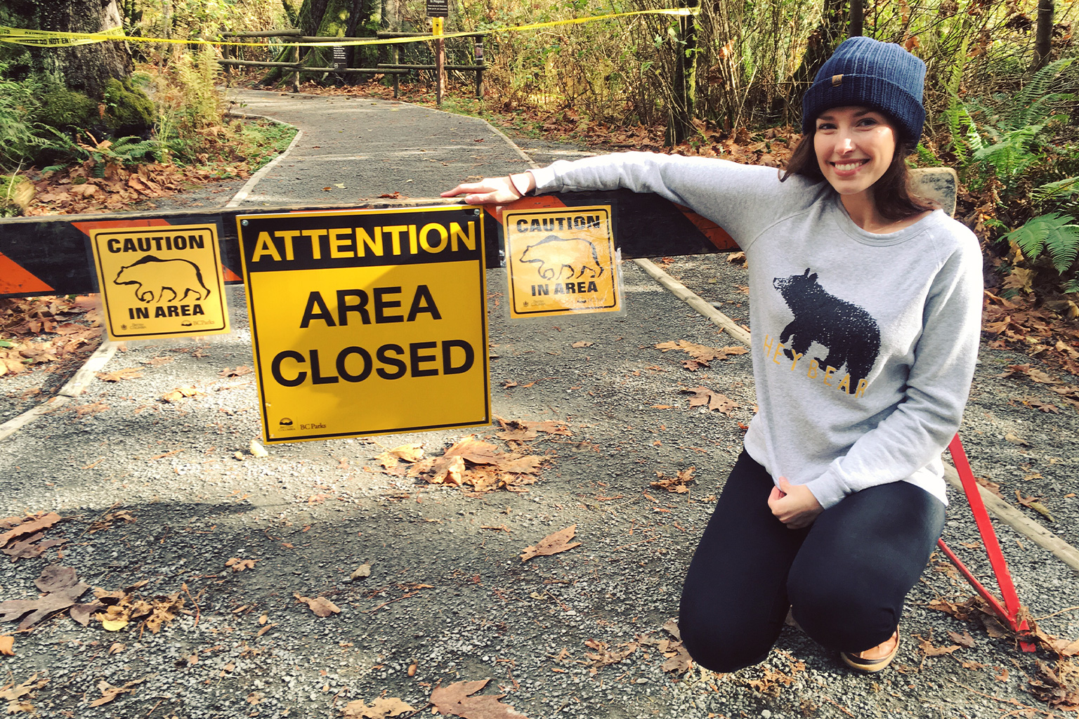 A sign warns of a closure for a black bear in the area at Goldstream Provincial Park in British Columbia, Canada.