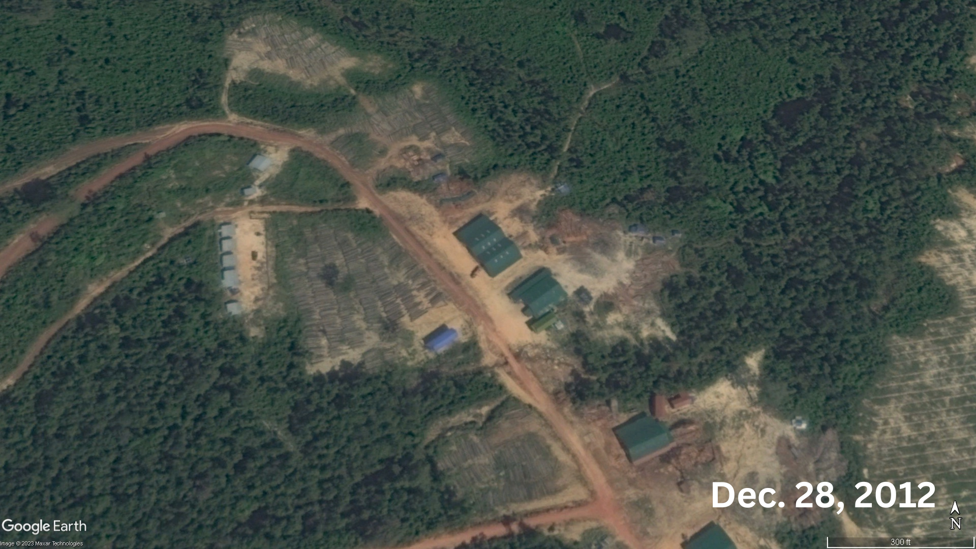 Google Earth imagery from Dec. 28, 2012 shows rows of logs stacked up inside LYP Group's concession in Botum Sakor National Park. Image by Gerald Flynn/Mongabay.