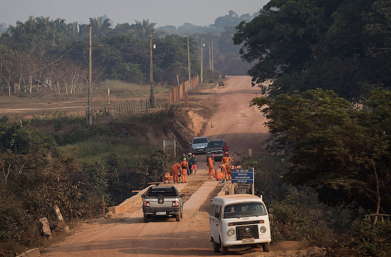 Workers perform maintenance on a BR230 bridge over the Marmelos River in Tenharim Marmelos Indigenous Territory. Image by Bruno Kelly/Amazonia Real via Wikimedia Commons (CC 2.0).