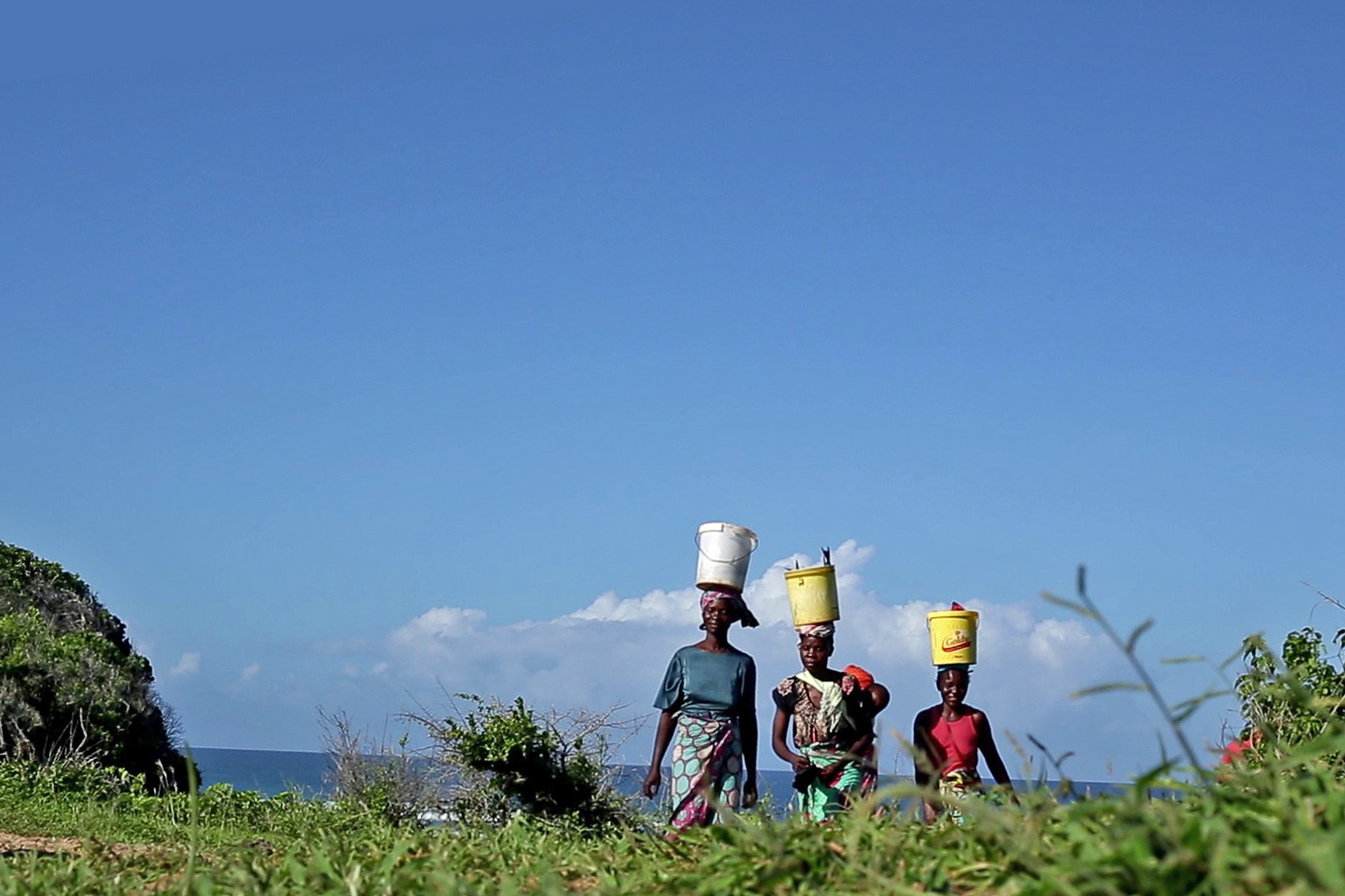 Fish traders heading out of Mwanamai fish landing site in Kuruwitu after buying fish from fishermen. 