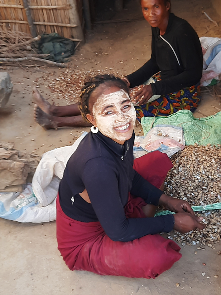 Women shelling peanuts at Lambokely village inside Menabe Antimena Protected Area.