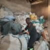 A worker at Stable Packaging sorts plastic waste ready for recycling.
