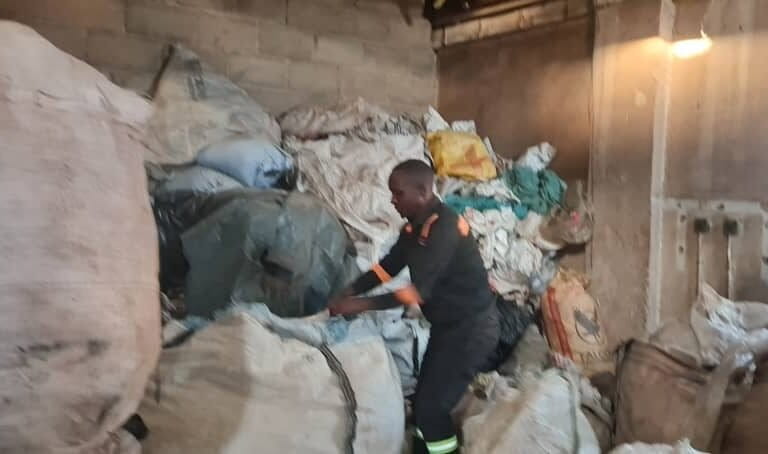 A worker at Stable Packaging sorts plastic waste ready for recycling.