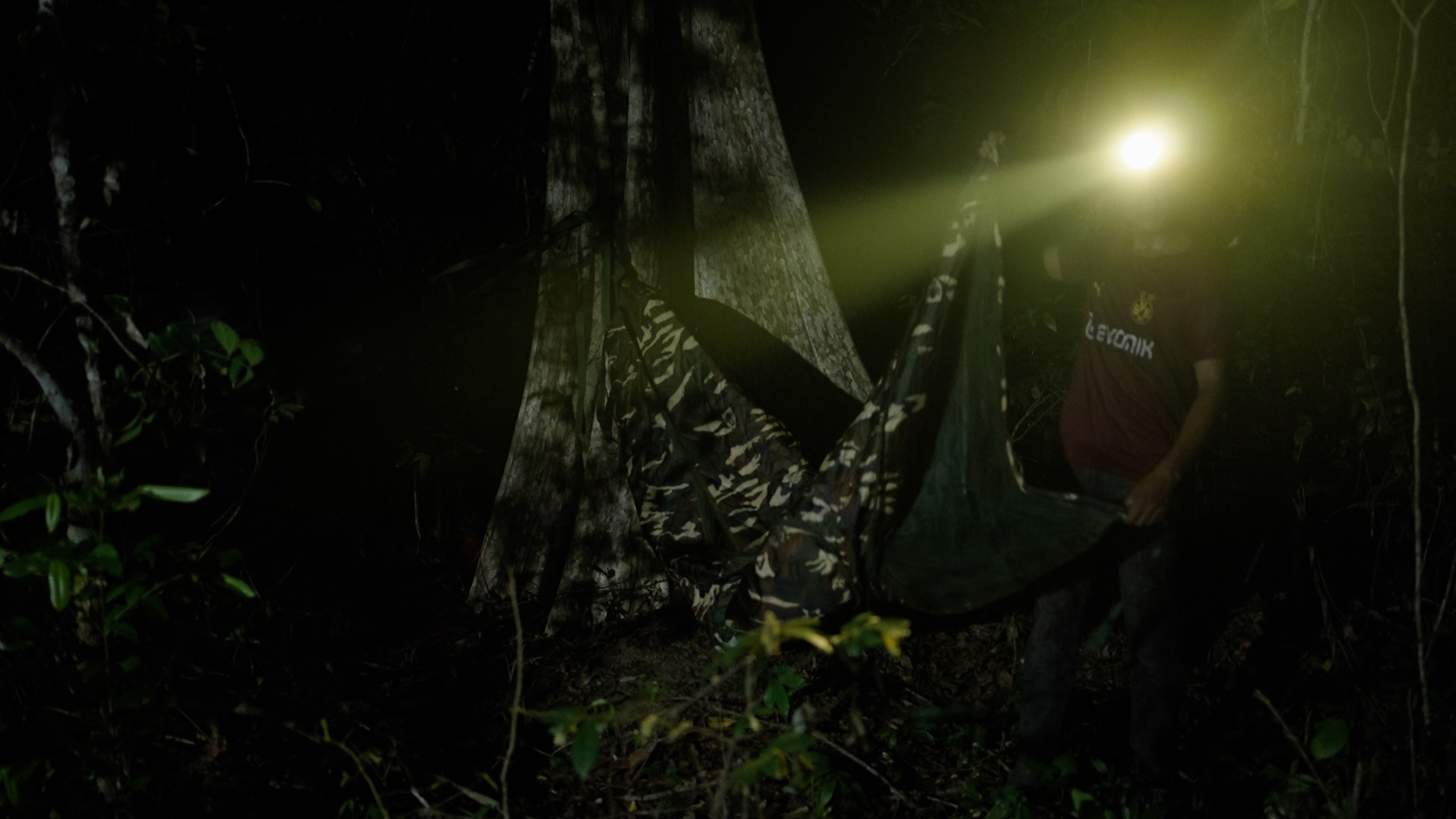 Members of the Prey Preah Roka Community Network set up camp after entering the protected forest at night to avoid detection. Image by Chasing Deforestation / Mongabay.