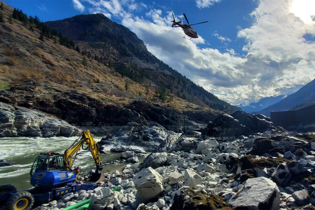 A helicopter and excavator were brought in on Oct. 13 to try to redirect the flow so that salmon could move upstream.