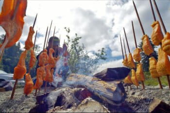 Salmon being traditionally baked by Council Member Jaytuk Steinruck of the Tolowa Dee-ni’ Nation.