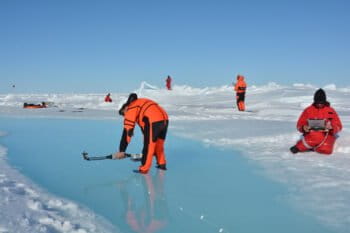 Marcel König and Natascha Oppelt (both from the University of Kiel, Germany) measuring melt pond optical properties during RV Polarstern campaign PASCAL, north of Svalbard in June 2017.
