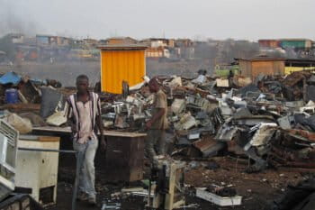 Workers in "Agbogbloshie," a site with electronic scrap material, in Ghana, 2011.