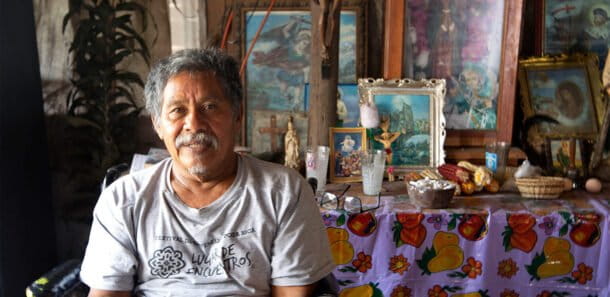 Alexandrino Garcia, an Abuelos de Tajín, in front of a Totonac altar in his house. Image by Monica Pelliccia.