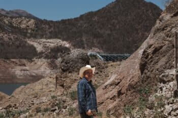 Behind Mario Luna Romero, a Yaqui spokesperson and water defender is the Plutarco Elías Calles (El Novillo) on the left and the Independencia Aqueduct on the right. Image by Abimael Ochoa Hernández.