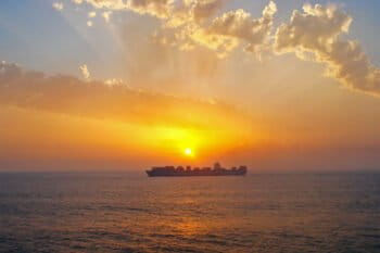 Sunset and a Maersk container ship.