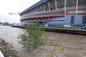Banner image of high river waters in Cardiff, Wales, by Sionk via Wikimedia Commons (CC BY-SA 4.0).