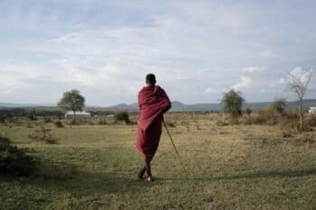 A Maasai looking over Ololosokwan. Image by Benjamin Hindrichs.