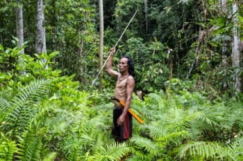 Sumean Gebe, 42 from the O'Hongana Manyawa tribe posing after hunting in a jungle at the East Halmahera, North Maluku, Indonesia, on August 19, 2024. Image by Garry Lotulung.