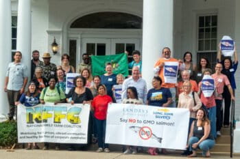The National Family Farm Coalition protests genetically engineered salmon at an event in Berea, Kentucky in August 2024.
