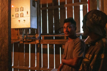 Bubot Bagawan explains how they generate electricity for their rice mill inside the micro-hydro generator’s powerhouse.