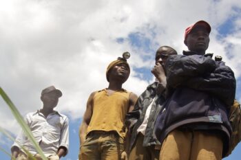 Miners waiting for an interview at a mining site. Image by Sasha Lezhnev/Enough Project via Flickr (CC BY-NC-ND 2.0).