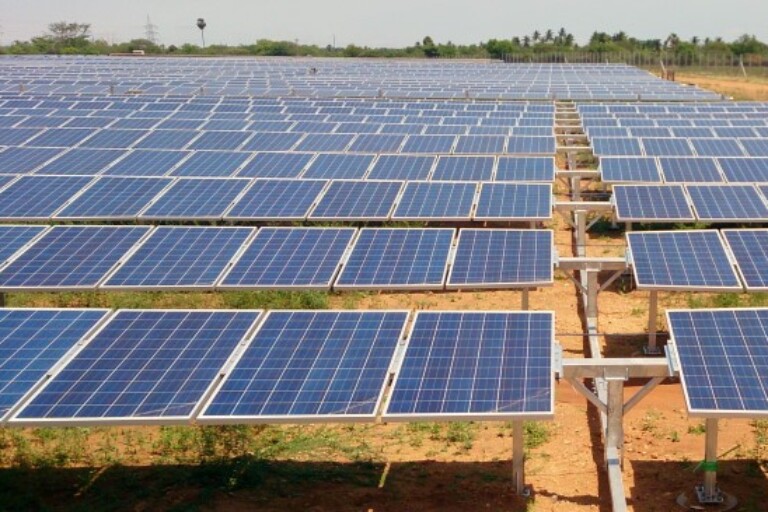 a solar farm by Vinaykumar8687 via Wikimedia Commons (CCBY-SA4.0).