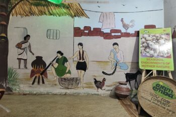 A painting at the Azam Emba restaurant in Ranchi depicting tribal life. Image by Kundan Pandey for Mongabay India.