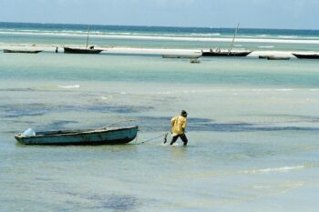 Fishermen in the ocean near Dar es Salaam, Tanzania. Image by UN Photo/Milton Grant via Flickr (CC BY-NC-ND 2.0).