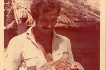 An archival image of Satish Bhaskar holding a hawksbill turtle. Image courtesy of Satish Bhaskar.