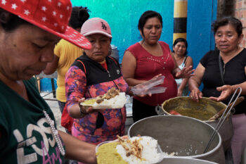 The families of fishers gather on Jan. 3 for a communal meal provided by the Talara Fishermen’s Guild.