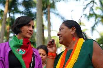 Susana Muhamad interacts with an Indigenous representative.