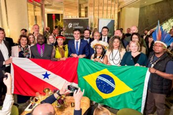 Pará Governor Helder Barbalho celebrates after signing the deal with the LEAF Coalition of corporations at New York Climate Week in September 2024. Image courtesy of SEMAS.
