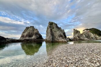 White rhyolite spires on the shores of Jodogahama Beach in Miyako, Japan. Iwate prefecture. These spires are estimated to be around 45 million years old, and form a natural version of a Japanese garden. This beach is part of the Sanriku Fukkō National Park. It was incorporated into this national park as a reconstruction effort following the Tōhoku Earthquake and Tsunami in 2011. Photo by Mike DiGirolamo/Mongabay.