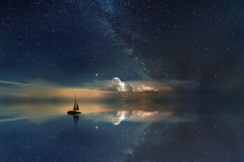 Sailboat at night. Image by Johannes Plenio via Unsplash.