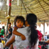 Munduruku people from the Sawré Muybu village gather in an assembly to receive feedback from Fiocruz on the hair sample test results determining levels of mercury contamination in people. Image by Joao Paulo Guimaeres via Flickr (CC BY-NC-SA 2.0)