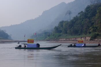 Boats sporting "No Dam" parade down the Salween River along the Thai-Myanmar border in March 2025. Image by Gerald Flynn / Mongabay.