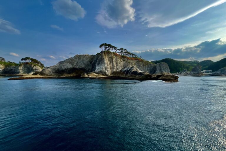 White rhyolite spires on the shores of Jodogahama Beach in Miyako, Japan. These spires are estimated to be around 45 million years old and form a natural version of a Japanese garden. This beach is part of Sanriku Fukkō National Park. It was incorporated into this national park as a reconstruction effort following the Tōhoku earthquake and tsunami in 2011. Image by Mike DiGirolamo for Mongabay.