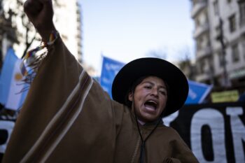 A woman chants slogans during a march towards the Palace of Justice during the celebrations of "La Pachamama," or Mother Earth Day in Buenos Aires, Argentina, Tuesday, Aug. 1, 2023. The group´s protest that coincides with “La Pachamama Day” is also directed against a provincial constitutional reform they claim is an attempt against their ancestral rights to lands that the state aims to use for lithium mining. (AP Photo/R