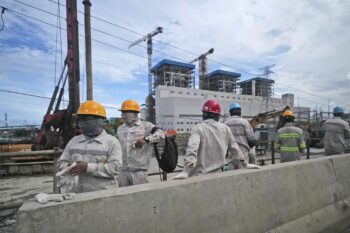 Workers are visible at the Indonesia Weda Bay Industrial Park's compound in Central Halmahera, North Maluku, Indonesia, Friday, June 7, 2024. Indonesia has been building out a vast industry for nickel. (AP Photo/Achmad Ibrahim)