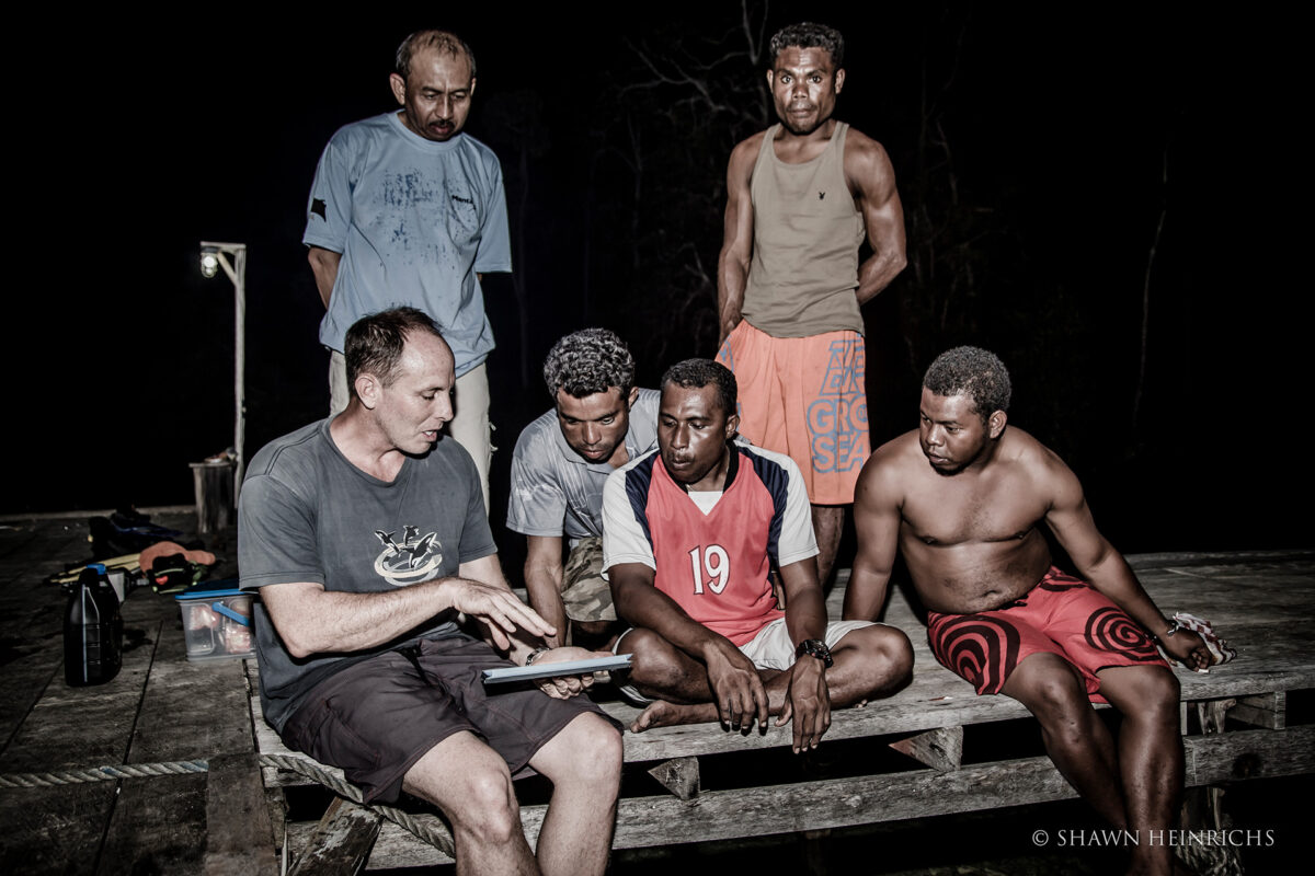 Mark Erdmann meeting with villagers in Raja Ampat. Photo by Shawn Heinrichs.
